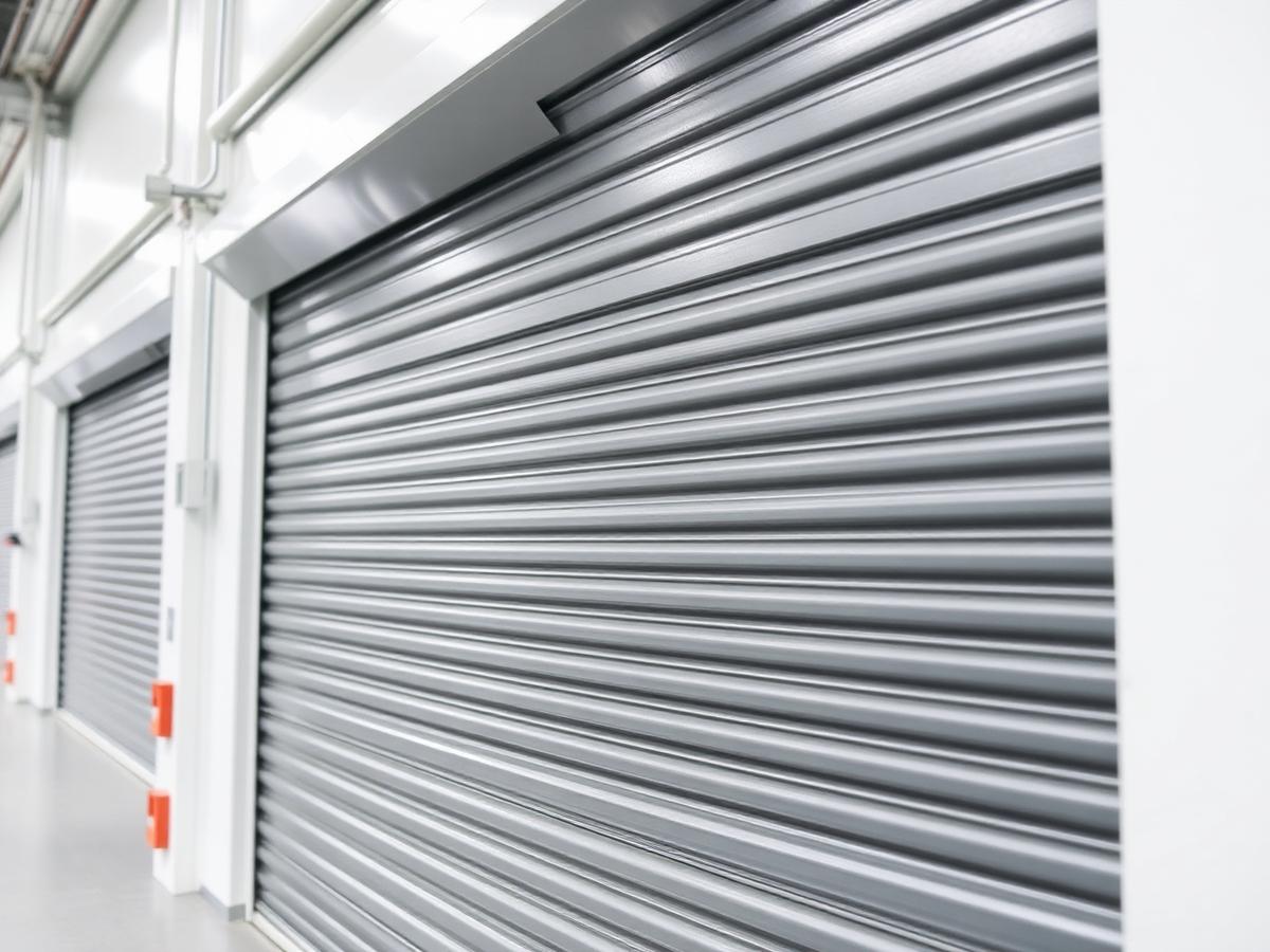 Bank of industrial roller shutter doors inside a warehouse