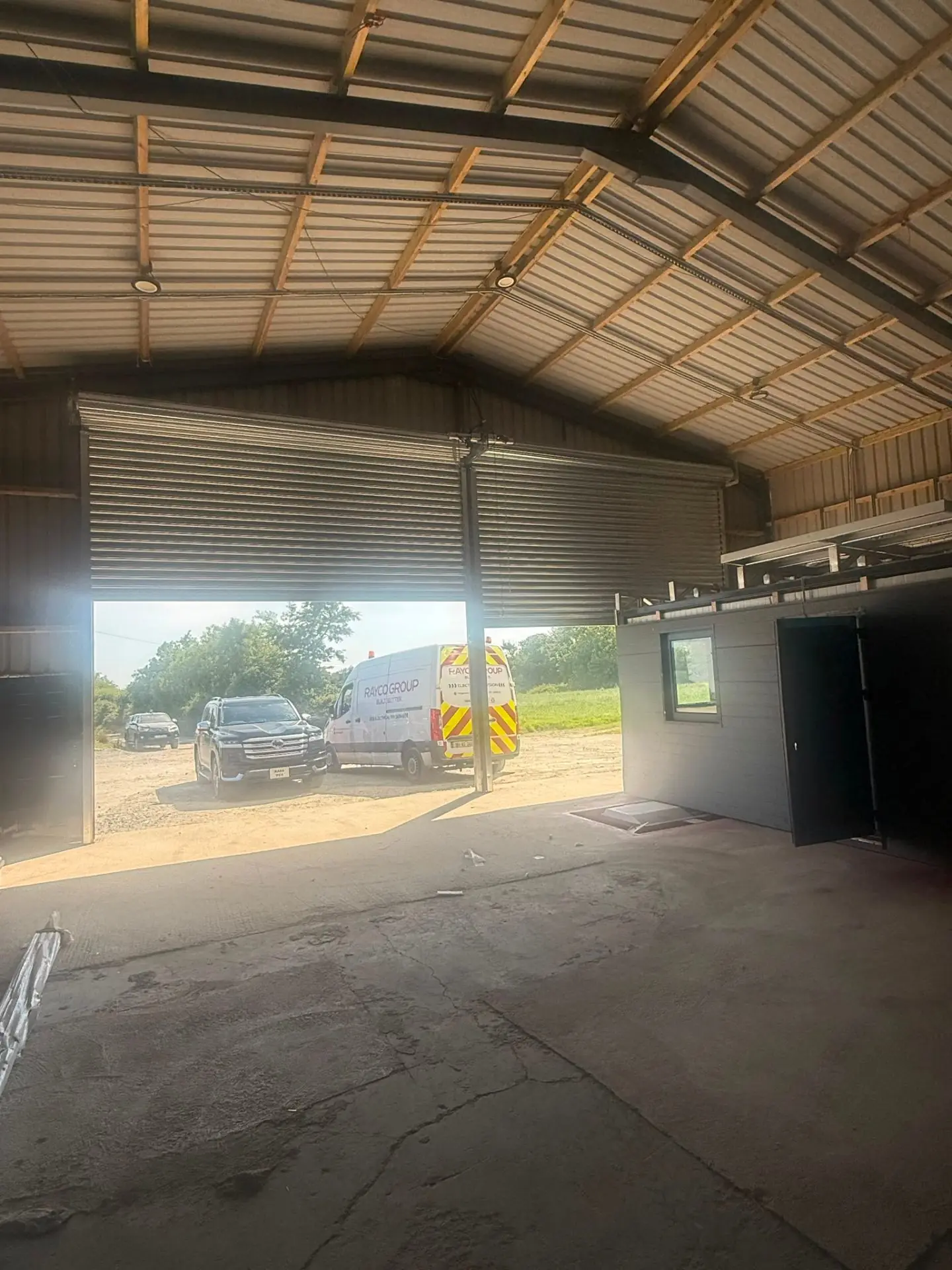 Rayco Group engineer installing an industrial roller shutter door at an Irish facility